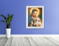 Obraz religijny na płótnie Jezus Chrystus Dobry Pasterz w białej ramie