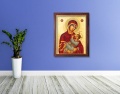Obraz religijny na płótnie Matka Boża Karmiąca w drewnianej ramie ze złotym paskiem